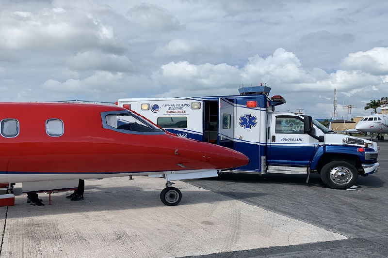 Air ambulance transfer - jet and ambulance on the tarmac